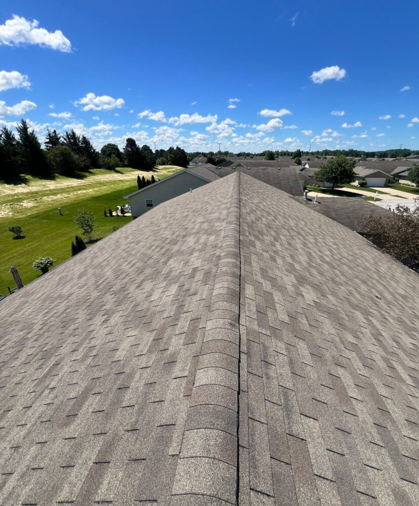Roof replacement in Michigan City Indiana featuring new asphalt shingles installed by Weldon Roofing & Construction